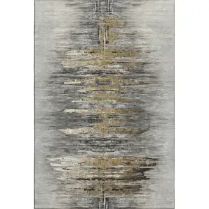Photo of Gray Silver And Gold Abstract Washable Area Rug With UV Protection