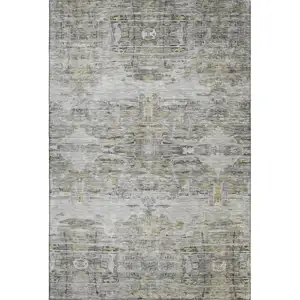Photo of Gray Silver And Gold Abstract Washable Area Rug With UV Protection