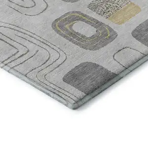 Photo of Gray Silver And Gold Geometric Washable Area Rug With UV Protection
