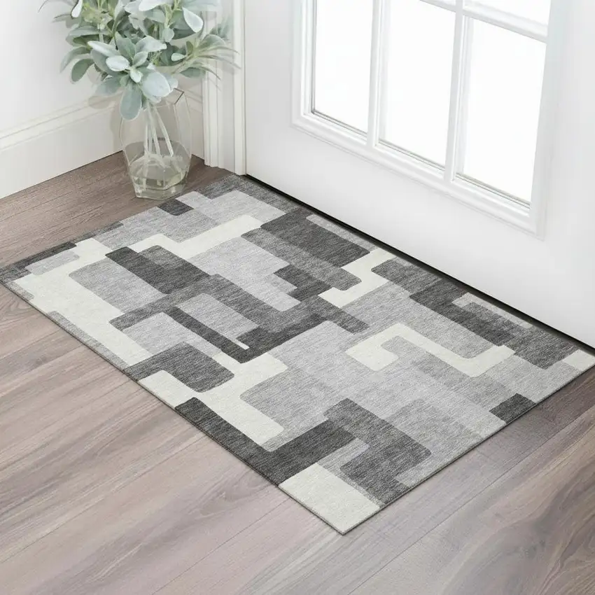 Gray Silver And Ivory Abstract Geometric Washable Area Rug With UV Protection Photo 1