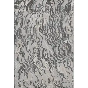 Photo of Gray Silver And Ivory Abstract Washable Area Rug With UV Protection