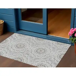 Photo of Gray Silver And Ivory Floral Medallion Washable Indoor Outdoor Area Rug