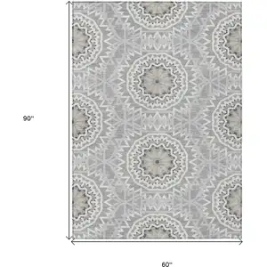Photo of Gray Silver And Ivory Floral Medallion Washable Indoor Outdoor Area Rug