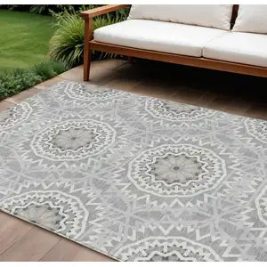 Photo of Gray Silver And Ivory Floral Medallion Washable Indoor Outdoor Area Rug