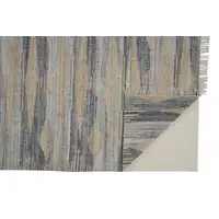 Photo of Gray Tan And Silver Abstract Hand Woven Stain Resistant Area Rug With Fringe