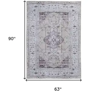 Photo of Gray Tan and Ivory Oriental Power Loom Worn Faded Washable Area Rug