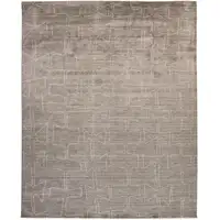 Photo of Gray Taupe And Ivory Abstract Hand Woven Area Rug