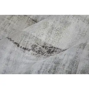 Photo of Gray Taupe And Ivory Abstract Hand Woven Area Rug