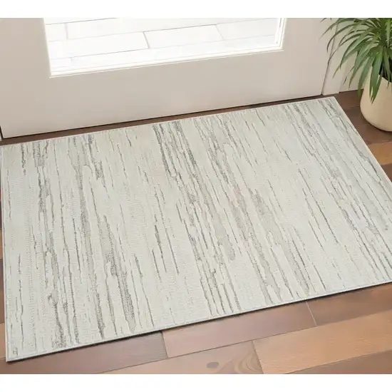 Gray and Beige Geometric Distressed Area Rug Photo 1