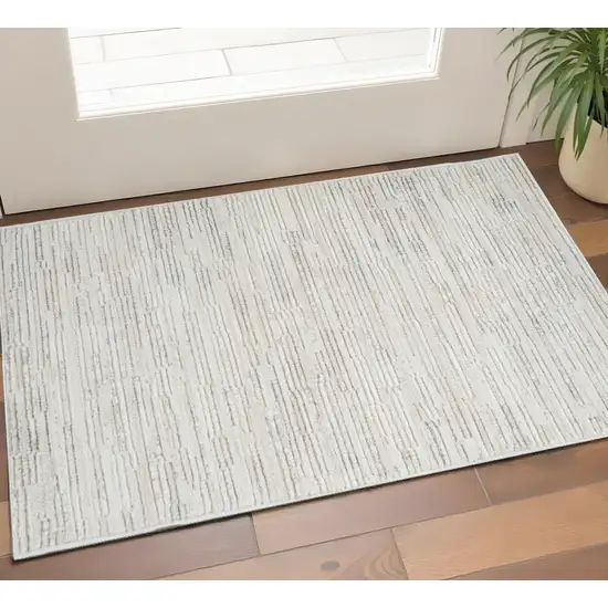 Gray and Beige Geometric Distressed Area Rug Photo 1