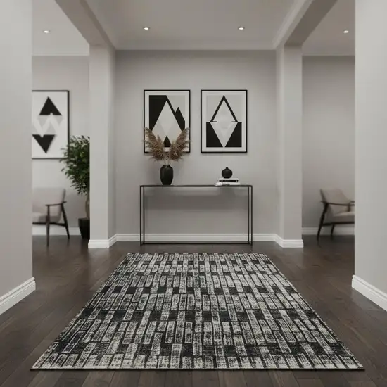 Gray and Black Geometric Power Loom Worn Faded Area Rug Photo 1