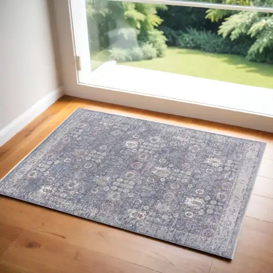 Gray and Blue Floral Power Loom Worn Faded Area Rug With Fringe Photo 1