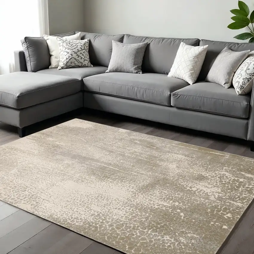 Gold Gray And Ivory Abstract Area Rug Photo 1