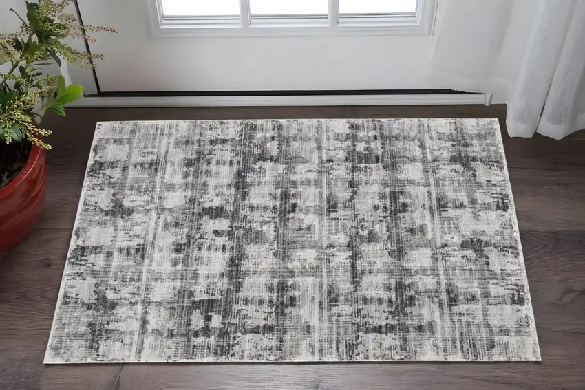 Gray and Ivory Abstract Power Loom Area Rug Photo 1