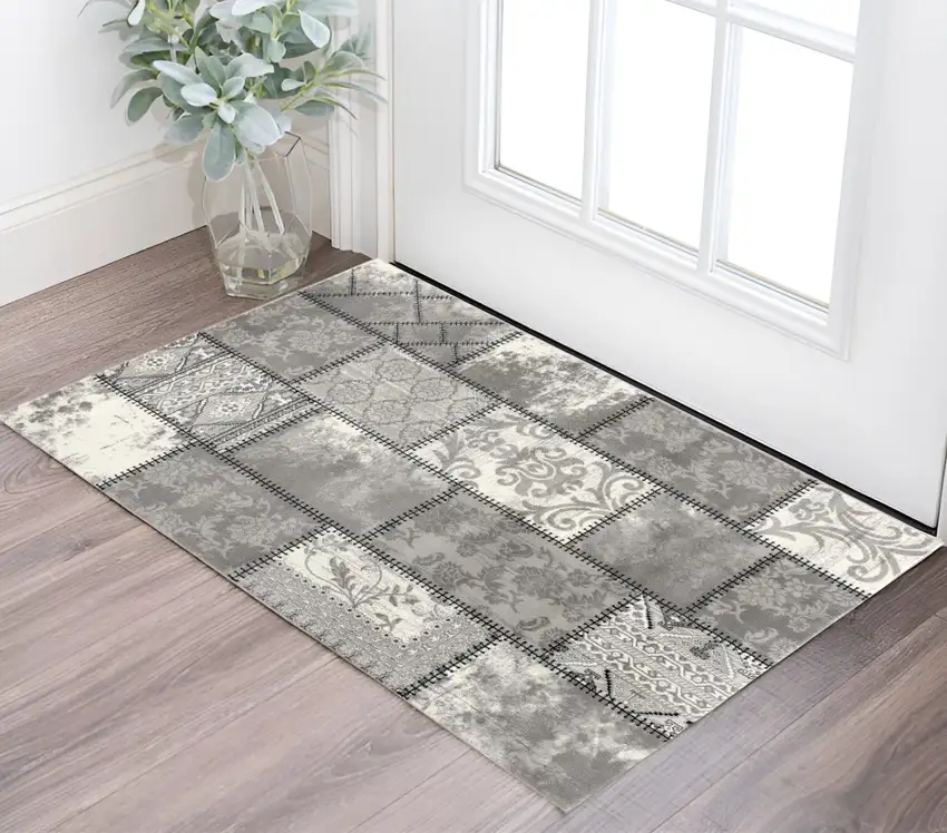 Gray and Ivory Damask Power Loom Area Rug Photo 1
