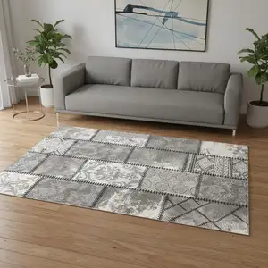 Photo of Gray and Ivory Damask Power Loom Area Rug
