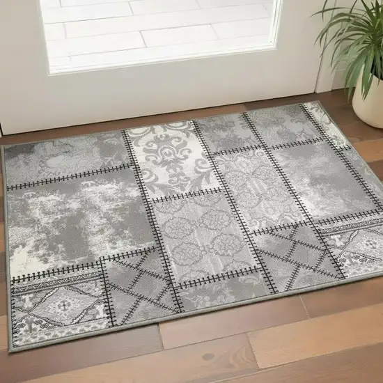 Gray and Ivory Damask Power Loom Area Rug Photo 1