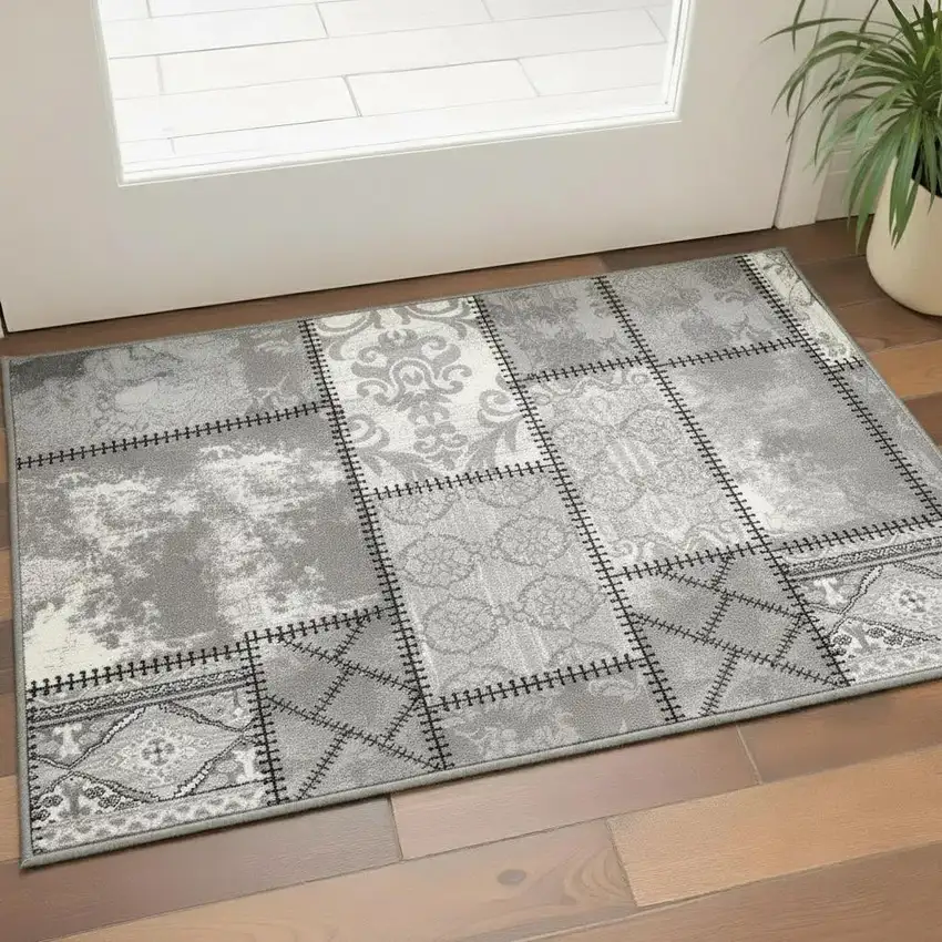 Gray and Ivory Damask Power Loom Area Rug Photo 1