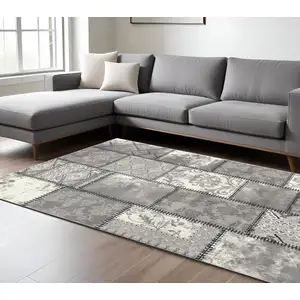 Photo of Gray and Ivory Damask Power Loom Area Rug
