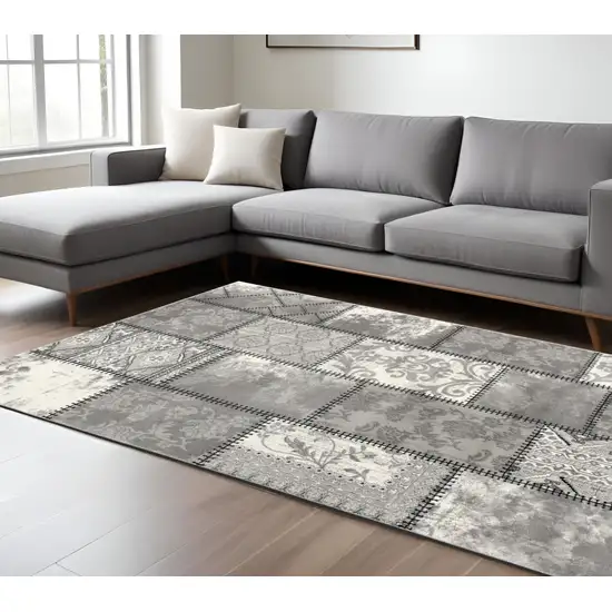 Gray and Ivory Damask Power Loom Area Rug Photo 1