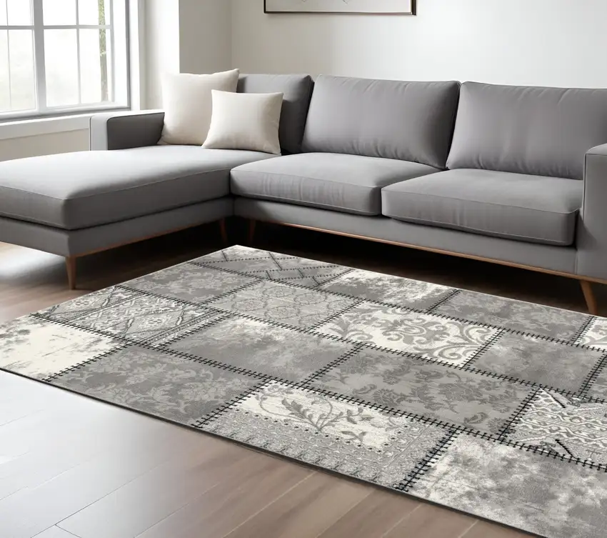 Gray and Ivory Damask Power Loom Area Rug Photo 1