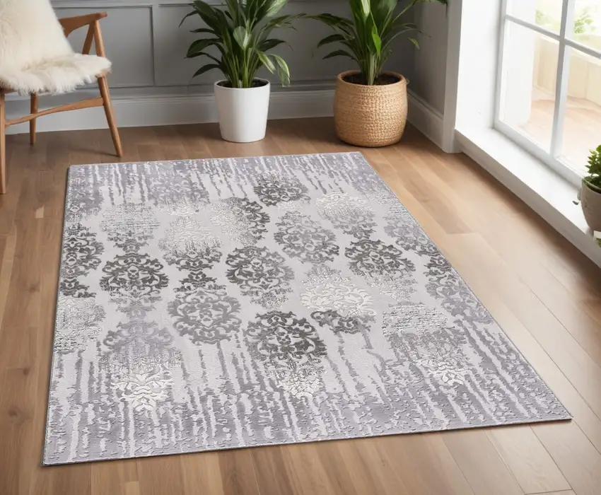 Gray and Ivory Damask Power Loom Area Rug Photo 1