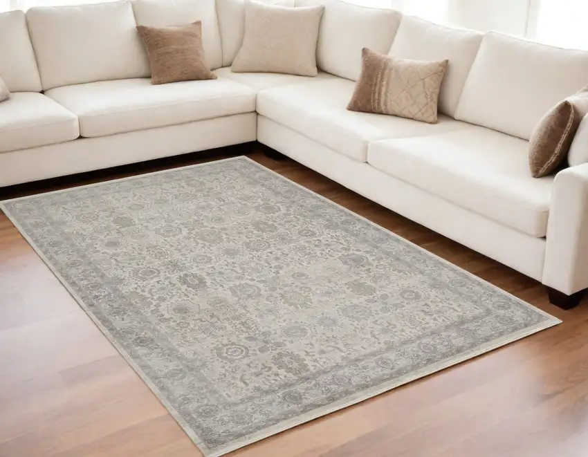 Gray and Ivory Oriental Power Loom Worn Faded Area Rug With Fringe Photo 1