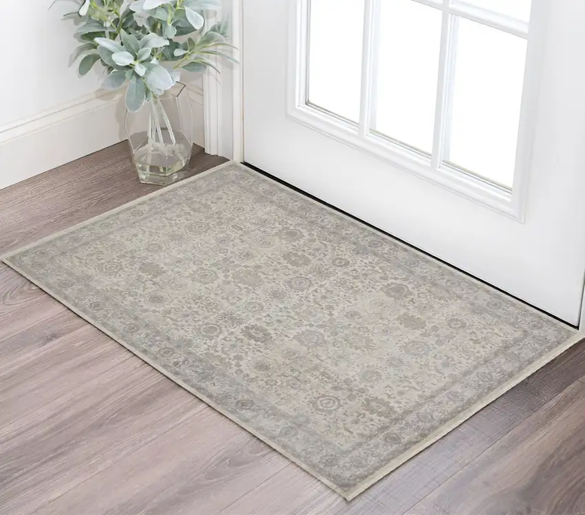 Gray and Ivory Oriental Power Loom Worn Faded Area Rug With Fringe Photo 1