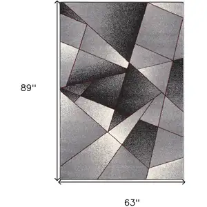 Photo of Gray and Red Prism Pattern Area Rug