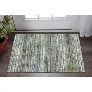 Photo of Green And Blue Geometric Distressed Area Rug