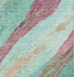 Photo of Green And Blush Abstract Washable Area Rug With UV Protection