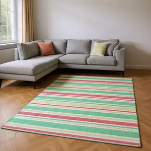 Photo of Green And Blush Striped Washable Area Rug With UV Protection