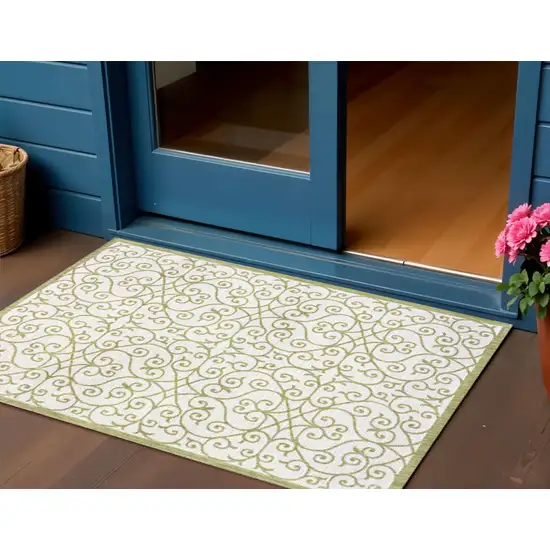 Green And Cream Geometric Indoor Outdoor Area Rug Photo 1