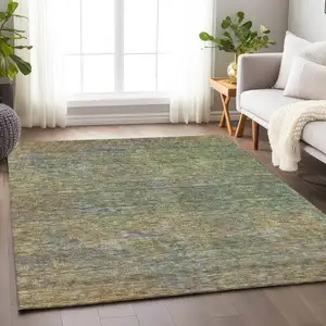 Photo of Green And Gold Abstract Washable Area Rug With UV Protection