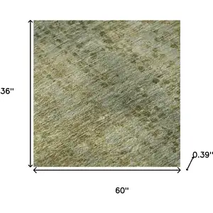 Photo of Green And Gold Abstract Washable Area Rug With UV Protection