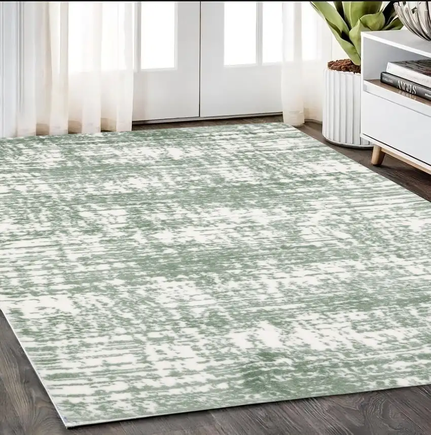 Green And Ivory Abstract Area Rug Photo 1