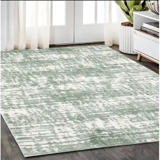 Green And Ivory Abstract Area Rug Photo 1