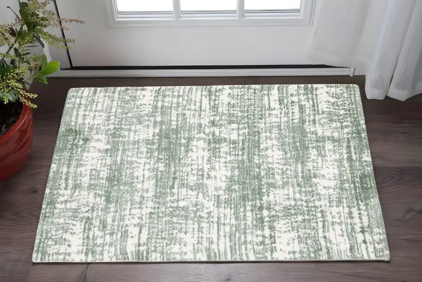 Green And Ivory Abstract Area Rug Photo 1