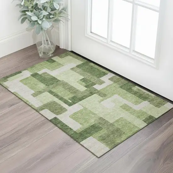 Green And Ivory Abstract Geometric Washable Area Rug With UV Protection Photo 1