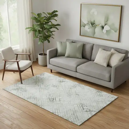 Green And Ivory Abstract Geometric Washable Area Rug With UV Protection Photo 1