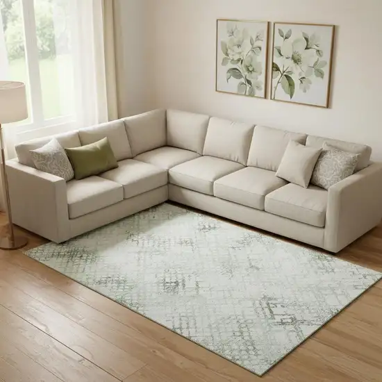 Green And Ivory Abstract Geometric Washable Area Rug With UV Protection Photo 1