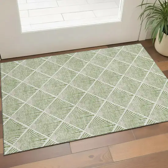 Green And Ivory Abstract Geometric Washable Area Rug With UV Protection Photo 1