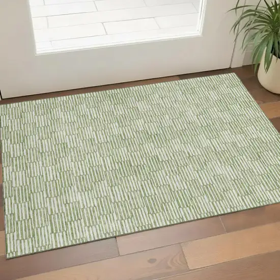 Green And Ivory Abstract Geometric Washable Area Rug With UV Protection Photo 1