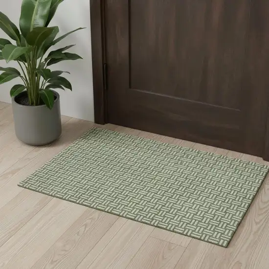 Green And Ivory Abstract Geometric Washable Area Rug With UV Protection Photo 1