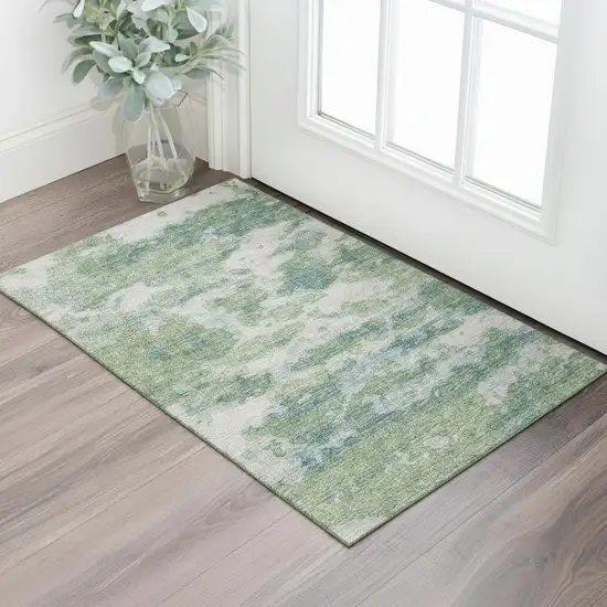 Green And Ivory Abstract Washable Area Rug With UV Protection Photo 1