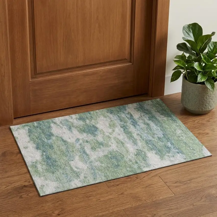 Green And Ivory Abstract Washable Area Rug With UV Protection Photo 1