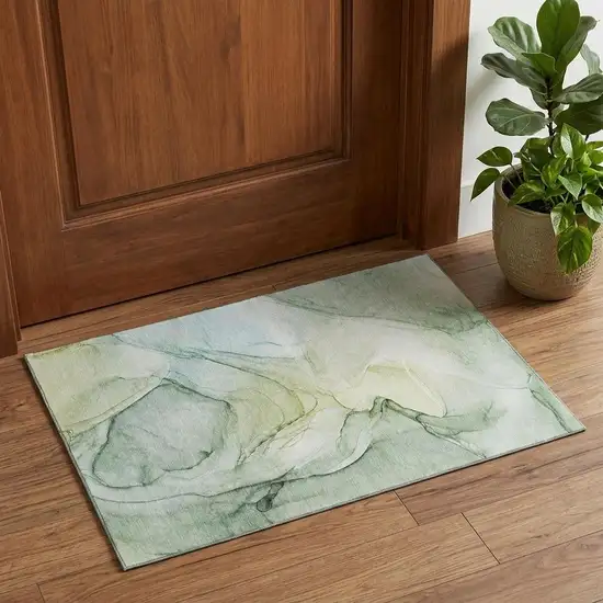 Green And Ivory Abstract Washable Area Rug With UV Protection Photo 1