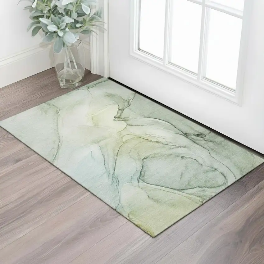 Green And Ivory Abstract Washable Area Rug With UV Protection Photo 1