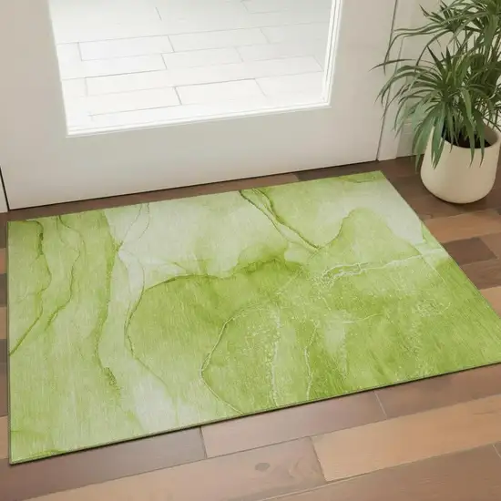 Green And Ivory Abstract Washable Area Rug With UV Protection Photo 1