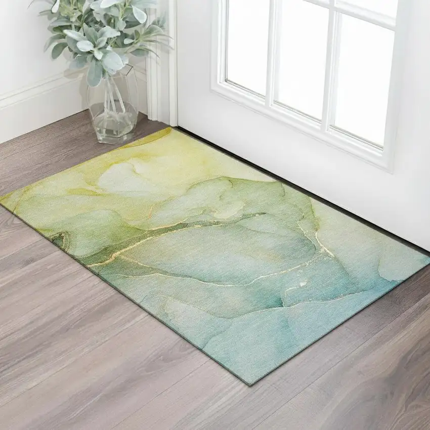 Green And Ivory Abstract Washable Area Rug With UV Protection Photo 1